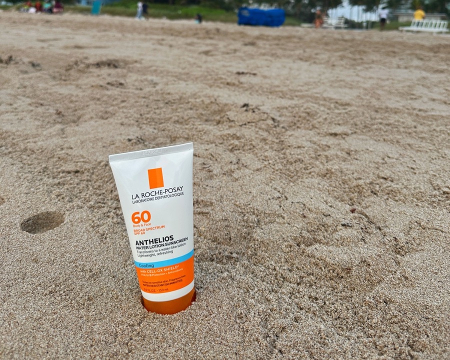 La Roche-Posay sunscreen in the sand on the beach